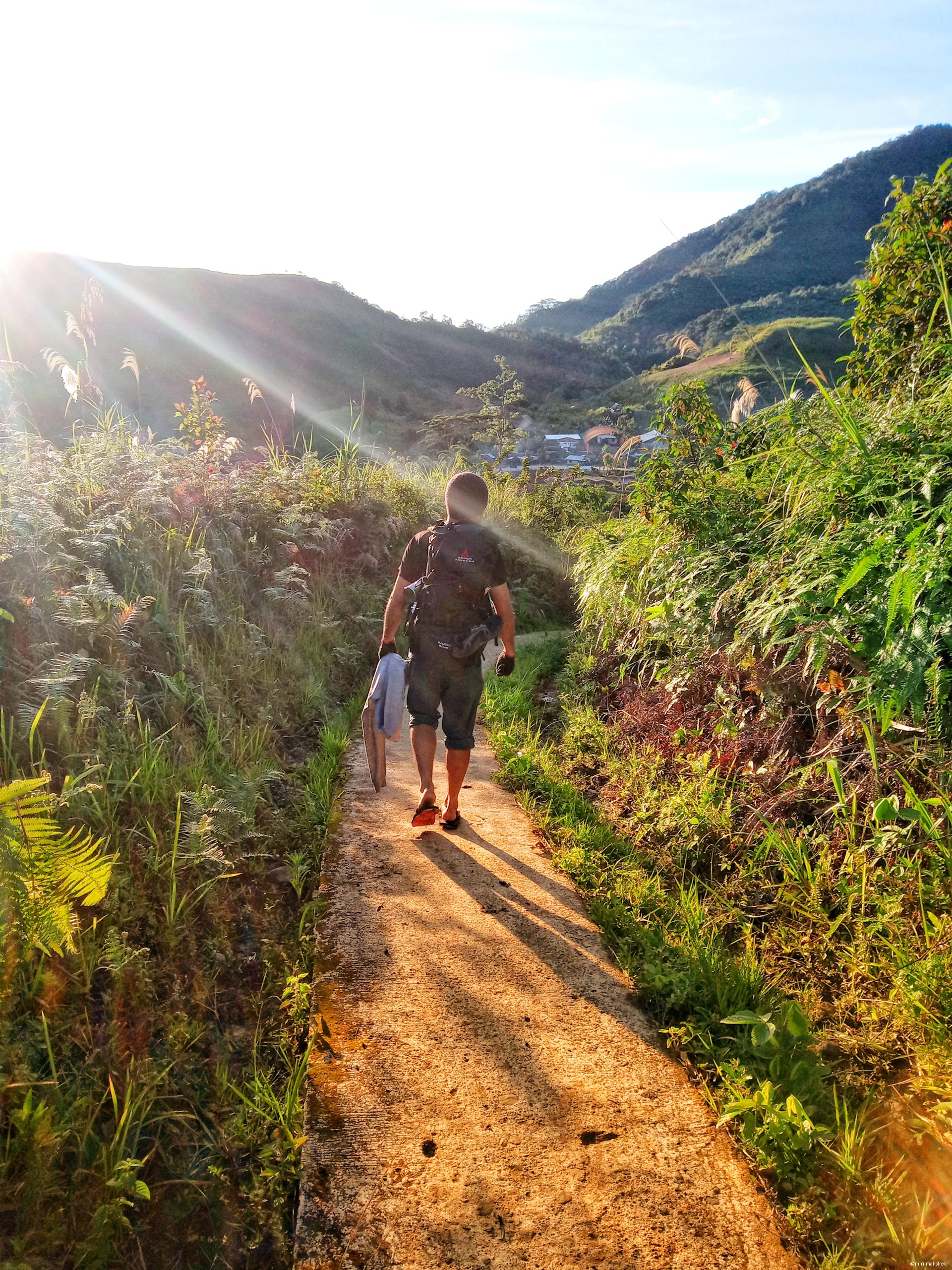 the golden morning sunlight streams through the hills