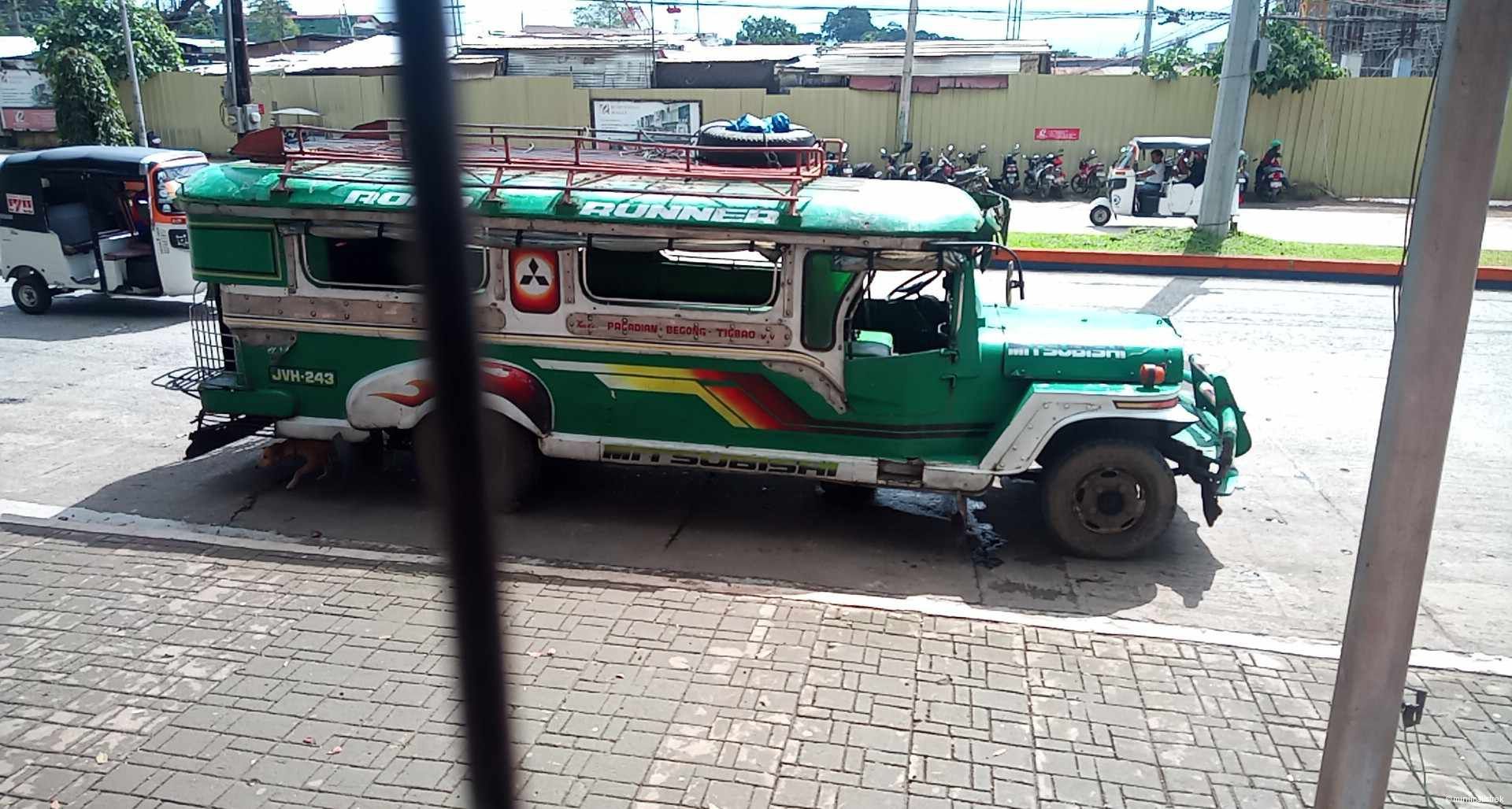 A colorful Philippine jeepney on the way to Tigbao